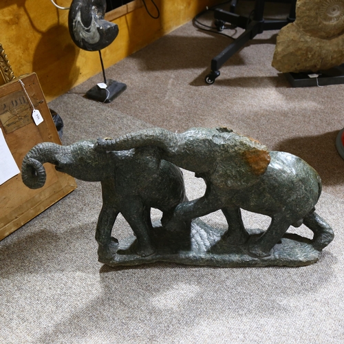 329 - An African green serpentine marble carved sculpture of 2 elephants, length approx 83cm