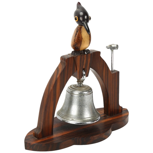 347 - HENRY HOWELL YZ for DUNHILL - a coromandel dinner bell surmounted by a bird, height 25cm