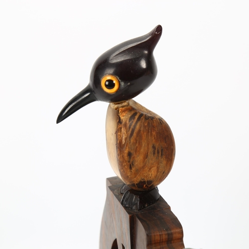 347 - HENRY HOWELL YZ for DUNHILL - a coromandel dinner bell surmounted by a bird, height 25cm