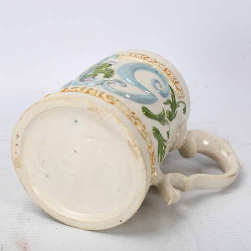 355 - Compton Pottery George V Coronation pint mug with relief moulded decoration, height 11cm