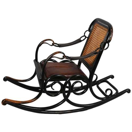 364 - A late 19th century Thonet No 3 rocking chair of unusual form, the ebonised bentwood frame with cane... 