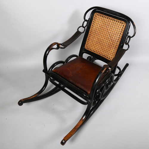 364 - A late 19th century Thonet No 3 rocking chair of unusual form, the ebonised bentwood frame with cane... 