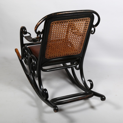 364 - A late 19th century Thonet No 3 rocking chair of unusual form, the ebonised bentwood frame with cane... 