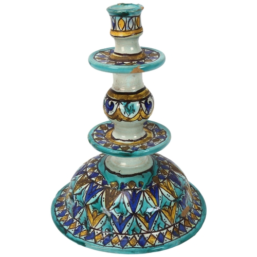 372 - A Moroccan pottery candlestick, with painted decoration, height 24cm