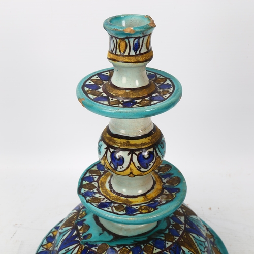 372 - A Moroccan pottery candlestick, with painted decoration, height 24cm