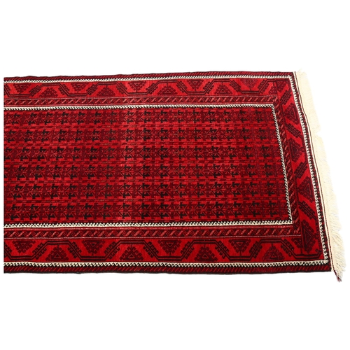 385 - Good quality Bokhara handmade red ground rug, 213cm x 122cm (7' x 4')