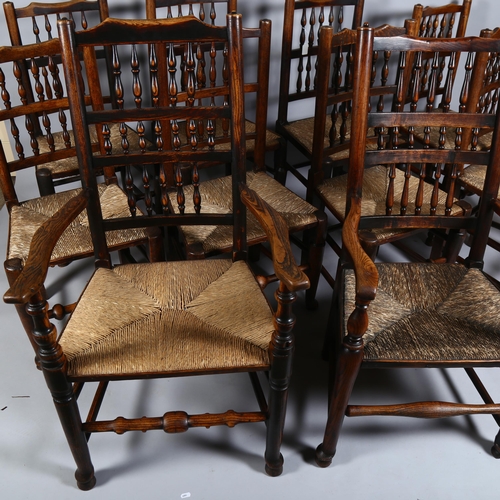 14 - A set of 10 (8 + 2) elm Lancashire spindle-back dining chairs, with rush seats, turned legs and pad ... 