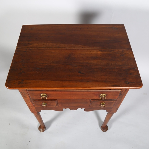 22 - A George III fruitwood lowboy, with single frieze drawer and 2 short dummy drawers below, turned leg... 