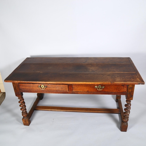 24 - An 18th century oak farmhouse table/writing desk, with 2 frieze drawers, barley twist supports and H... 