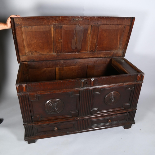 31 - An 17th century oak mule chest, with panel top, 2-panel carved front and single drawer under, 133 x ... 