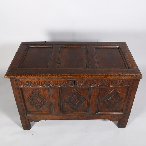 41 - A 17th century oak coffer, with chip carved lozenge panels, 100 x 54 x 63cm