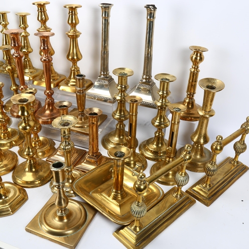 43 - A large quantity of Antique brass candlesticks, 17th - 19th century