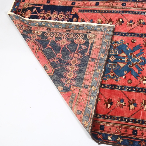 46 - A mid-20th century Caucasus Shirvan red and blue ground wool rug, 185 x 115cm