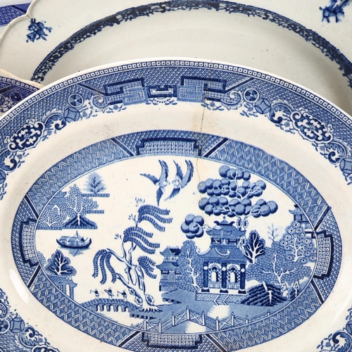 47 - A group of 19th century English blue and white transfer chinoiserie meat plates, largest 50cm x 40cm... 