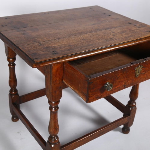 9 - An 18th century oak low boy, circa 1720-30, with single frieze drawer and turned supports, 76 x 56cm... 