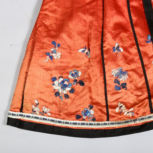 237A - A Chinese red silk underskirt with hand embroidered blossom and butterflies, probably early 20th cen... 