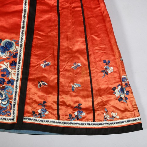 237A - A Chinese red silk underskirt with hand embroidered blossom and butterflies, probably early 20th cen... 