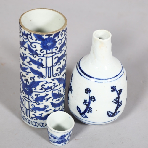 395 - 3 pieces of Oriental blue and white glazed ceramics, Chinese Cylinder vase and beakers with characte... 