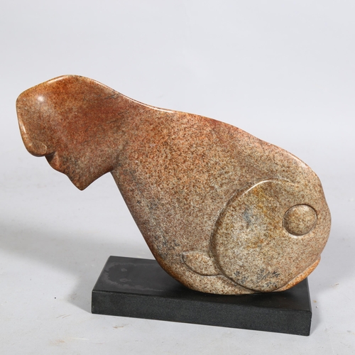 399 - A carved and polished red/brown granite fish on black granite base, length 33cm