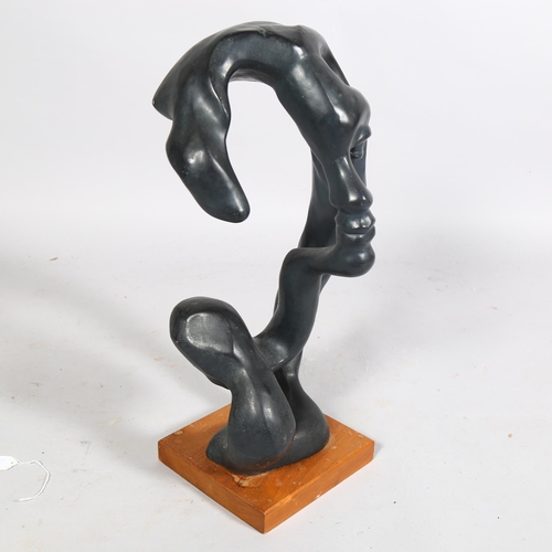 401 - A abstract sculpture of a face, composite patinated material, on wooden base, overall height 56cm