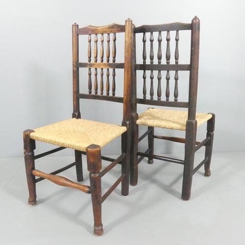 2153 - A matched pair of North Country elm and rush-seated spindle back side chairs.