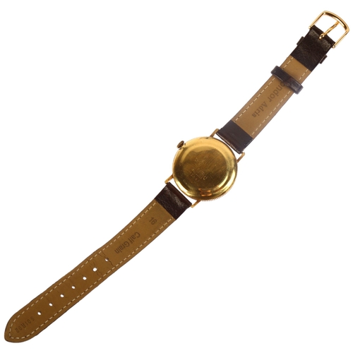 1009 - BULER - a Swiss 18ct gold Flatline quartz wristwatch, champagne dial with slimline baton hour marker... 