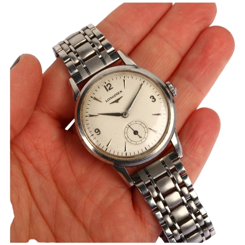 1010 - LONGINES - a Vintage stainless steel mechanical bracelet watch, circa 1960s, silvered dial with appl... 