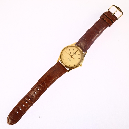 1031 - OMEGA - a gold plated stainless steel De Ville quartz wristwatch, champagne honeycomb dial with appl... 