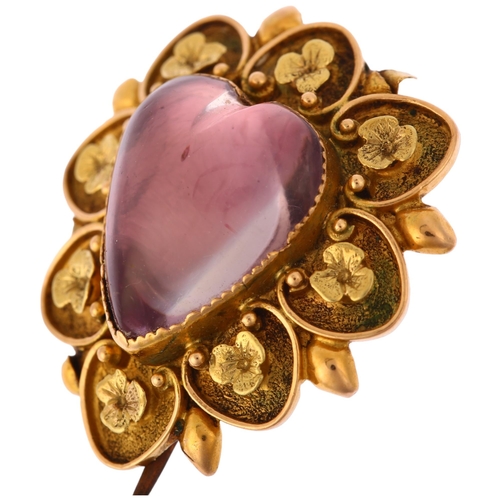 1104 - A Victorian pinchbeck? foil-backed amethyst heart mourning brooch, the central heart cabochon amethy... 