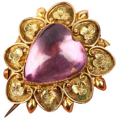 1104 - A Victorian pinchbeck? foil-backed amethyst heart mourning brooch, the central heart cabochon amethy... 