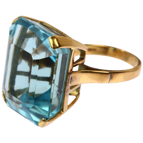 1108 - An impressive 18ct gold aquamarine cocktail ring, set with 39ct emerald step-cut aquamarine, weight ... 