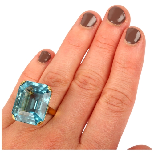 1108 - An impressive 18ct gold aquamarine cocktail ring, set with 39ct emerald step-cut aquamarine, weight ... 