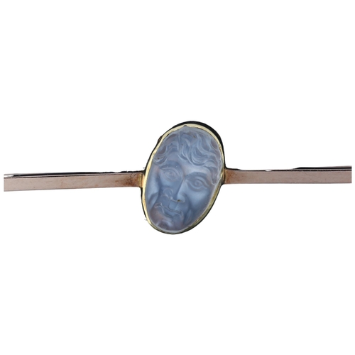 1109 - An early 20th century moonstone 'man in the moon' bar brooch, unmarked rose gold settings with oval ... 