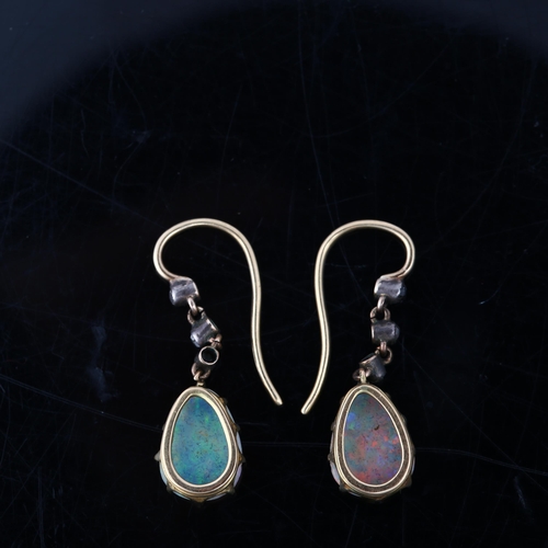 1113 - A pair of Edwardian opal and diamond drop earrings, the unmarked gold and silver settings with pear ... 