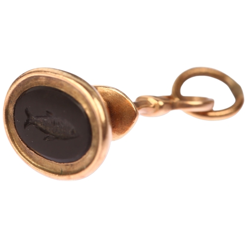 1114 - A Georgian miniature fish intaglio seal fob, in unmarked rose gold frame set with oval flat-top onyx... 