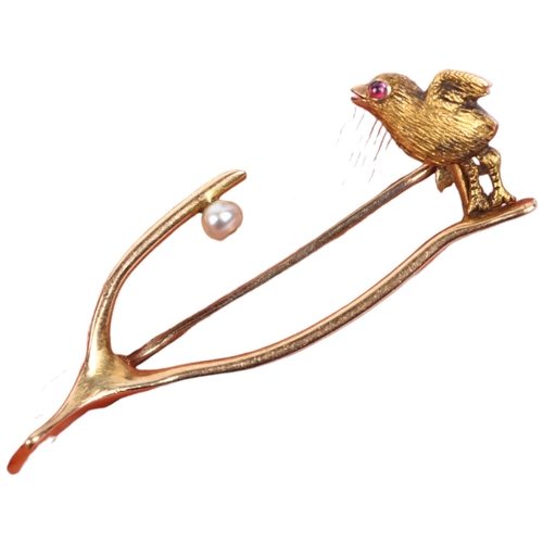 1121 - A Victorian ruby and pearl chick wishbone brooch, by Goldsmiths & Silversmiths Co Ltd, unmarked gold... 