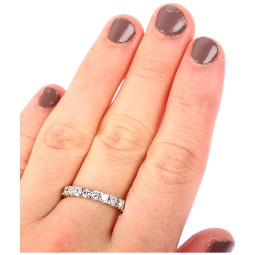 1130 - A diamond full eternity ring, unmarked white metal settings with modern round brilliant-cut diamonds... 