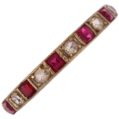 1133 - An Art Deco 9ct white gold ruby and paste full eternity ring, set with calibre-cut rubies and round-... 