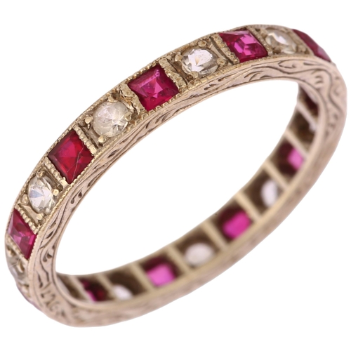 1133 - An Art Deco 9ct white gold ruby and paste full eternity ring, set with calibre-cut rubies and round-... 