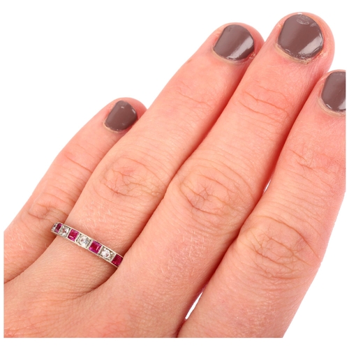 1133 - An Art Deco 9ct white gold ruby and paste full eternity ring, set with calibre-cut rubies and round-... 