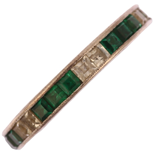 1134 - An Art Deco green and white paste full eternity ring, unmarked white metal settings with square-cut ... 