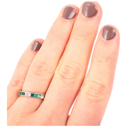 1134 - An Art Deco green and white paste full eternity ring, unmarked white metal settings with square-cut ... 