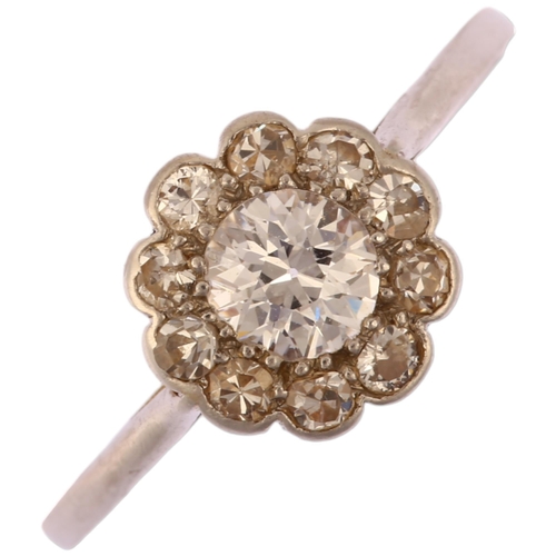 1137 - An early 20th century platinum diamond flowerhead cluster ring, set with old European and single-cut... 