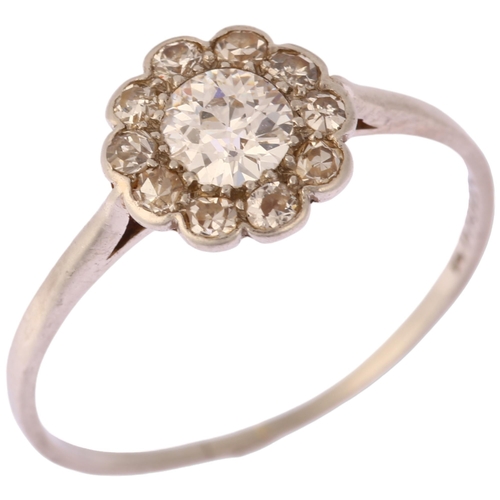 1137 - An early 20th century platinum diamond flowerhead cluster ring, set with old European and single-cut... 