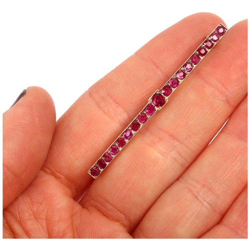 1148 - A Victorian ruby line bar brooch, unmarked gold settings, pave set with round-cut rubies, 51.8mm, 3.... 