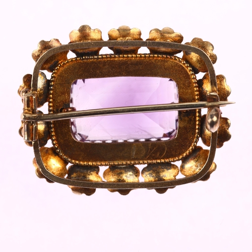 1151 - A Victorian amethyst floral brooch, circa 1860, unmarked gold settings, with 11.5ct modified rectang... 