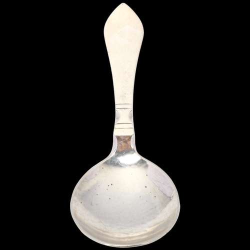 1694 - GEORG JENSEN - a Danish stylised sterling silver Antik/Continental tea caddy spoon, circa 1927, plan... 