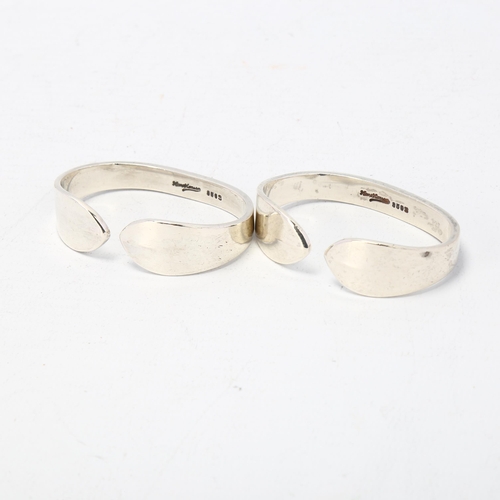 1695 - HANS HANSEN - a pair of Danish modernist sterling torque napkin rings, 5.5cm, 1.8oz total