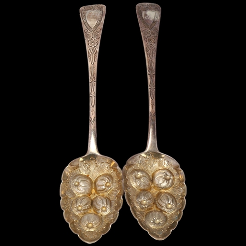 1696 - A pair of George III silver Old English pattern berry spoons, maker ID, London 1813, relief embossed... 