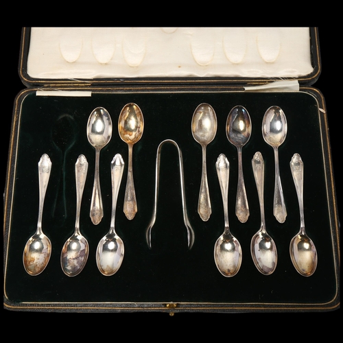 1703 - A cased set of 11 George V silver teaspoons and matching sugar tongs, Mappin & Webb Ltd, Sheffield 1... 